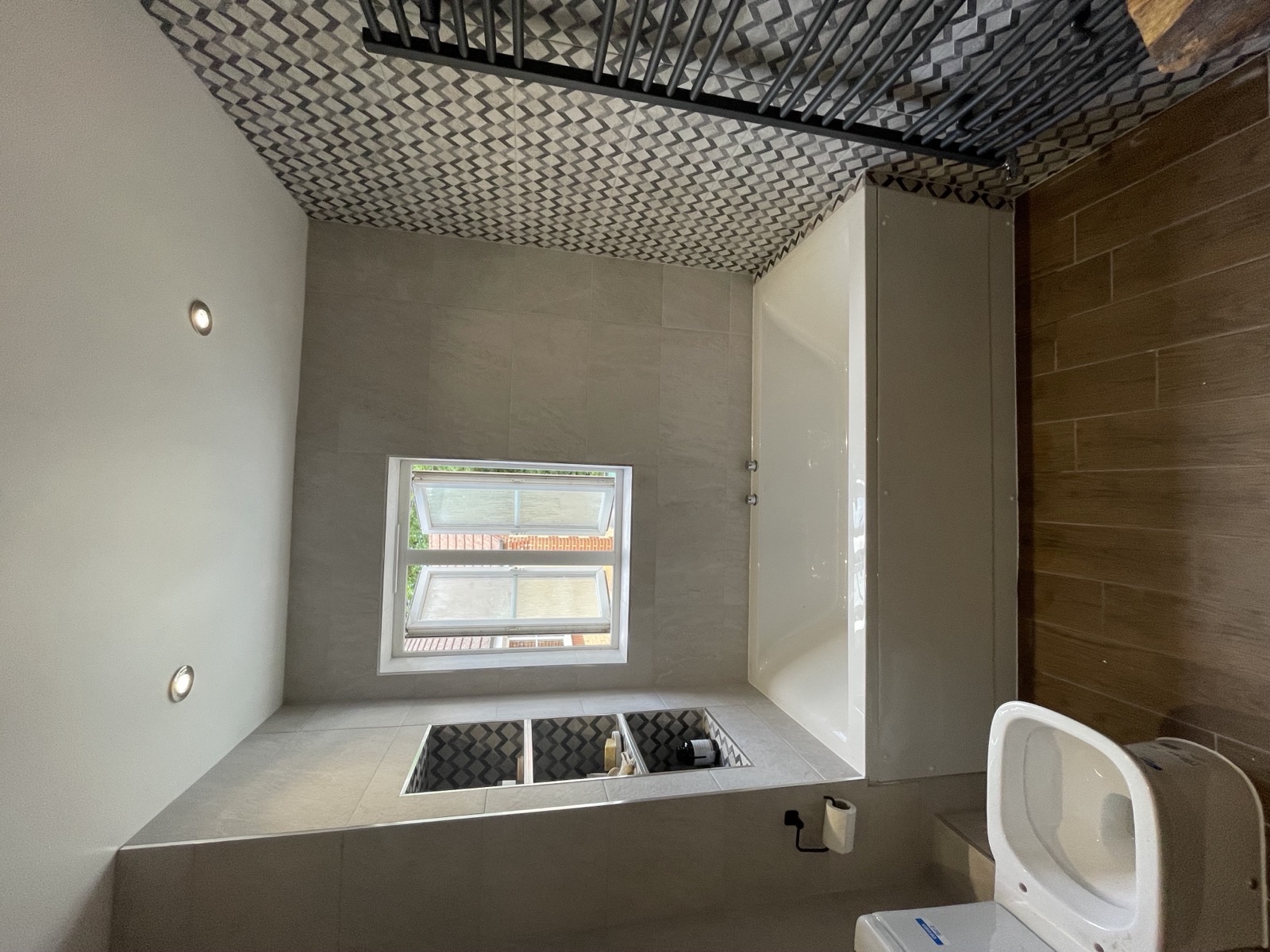 Luxury freestanding tub and stone tile layout